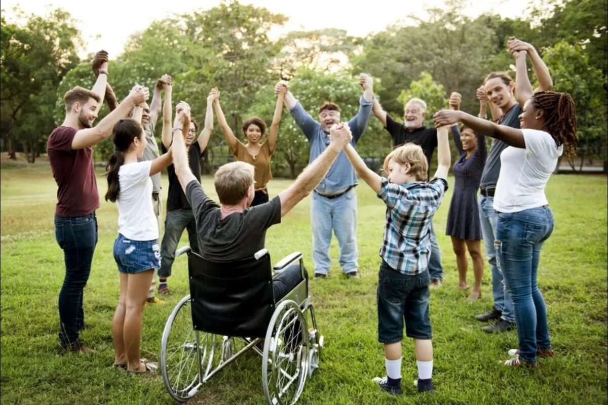 "Group of people engaging in a community activity with participants.”